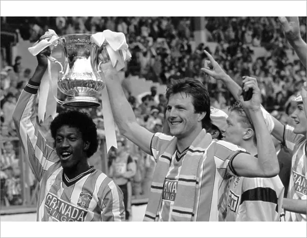 (L-R) Coventry Citys goalscorers Dave Bennett and Keith Houchen celebrate with the FA Cup after their 3-2 victory