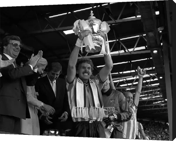 Coventry City captain Brian Kilcline lifts the FA Cup after his teams 3-2 victory
