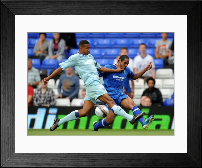 Framed Print : Birmingham City vs Coventry City: Intense Battle for the Ball - Cyrus Christie vs Jean Beausejour Framed Print : Birmingham City vs Coventry City: Intense Battle for the Ball - Cyrus Christie vs Jean Beausejour
