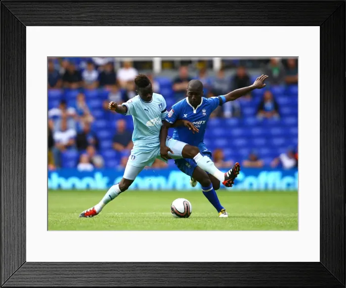 Framed Print : Intense Rivalry: Bigirimana vs. Gomis - The Battle for Ball Supremacy between Coventry City and Birmingham City Framed Print : Intense Rivalry: Bigirimana vs. Gomis - The Battle for Ball Supremacy between Coventry City and Birmingham City