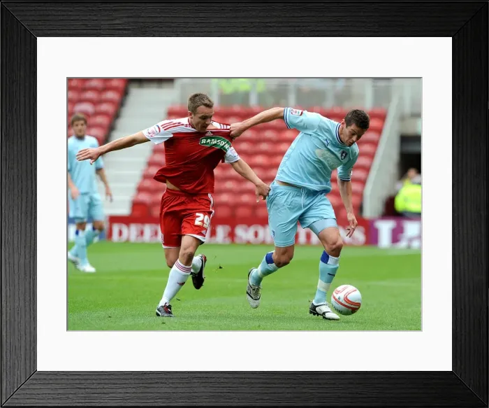Framed Print : Battling for Supremacy: McMahon vs. Jutkiewicz in the Npower Championship Clash between Middlesbrough and Coventry City Framed Print : Battling for Supremacy: McMahon vs. Jutkiewicz in the Npower Championship Clash between Middlesbrough and Coventry City