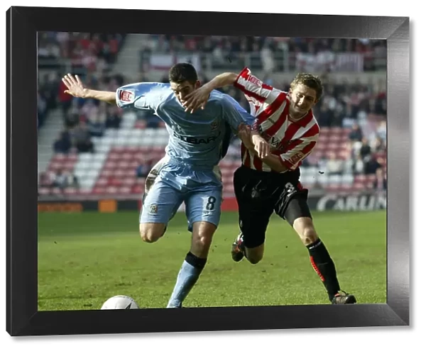 George McCartney vs. Richard Duffy: Intense Rivalry in the Championship Clash between Sunderland and Coventry City (Stadium of Light, 17-03-2005)