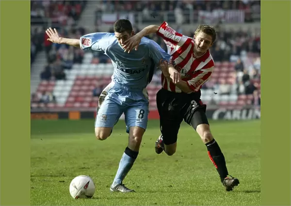George McCartney vs. Richard Duffy: Intense Rivalry in the Championship Clash between Sunderland and Coventry City (Stadium of Light, 17-03-2005)