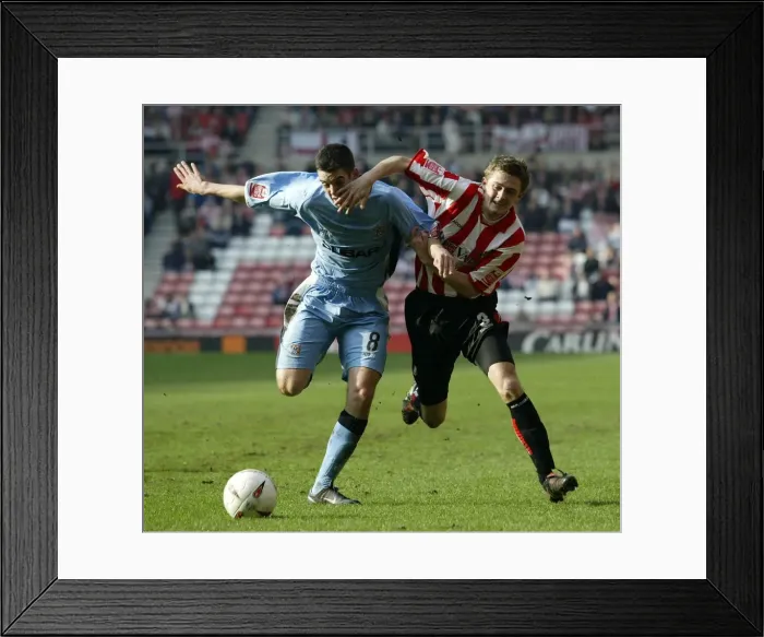 Framed Print : George McCartney vs. Richard Duffy: Intense Rivalry in the Championship Clash between Sunderland and Coventry City (Stadium of Light, 17-03-2005) Framed Print : George McCartney vs. Richard Duffy: Intense Rivalry in the Championship Clash between Sunderland and Coventry City (Stadium of Light, 17-03-2005)
