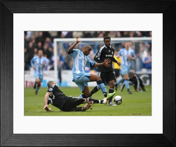 Framed Print : Clinton Morrison Leaps Over Chelsea's Alex in FA Cup Sixth Round Showdown at Ricoh Arena Framed Print : Clinton Morrison Leaps Over Chelsea's Alex in FA Cup Sixth Round Showdown at Ricoh Arena