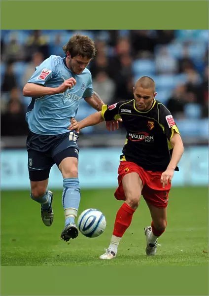 Coventry City vs Watford: Intense Battle for the Ball in the Championship - Aron Gunnarsson vs Henri Lansbury (Ricoh Arena, 02-05-2010)