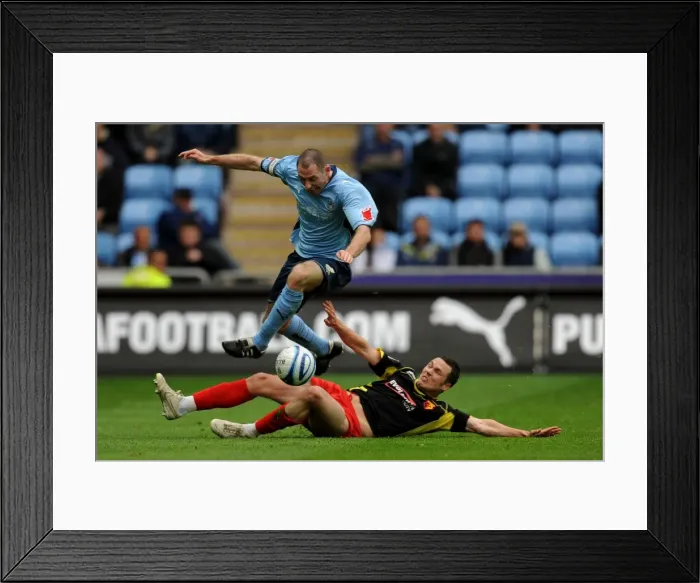Framed Print : Coventry City vs. Watford: Battle for the Ball - Stephen Wright Leaps Clear of Don Cowie (Championship, 02-05-2010) Framed Print : Coventry City vs. Watford: Battle for the Ball - Stephen Wright Leaps Clear of Don Cowie (Championship, 02-05-2010)