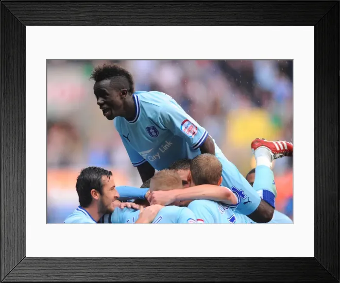Framed Print : Coventry City's Double Celebration: Gael Bigirimana and Carl Baker Score in Championship Match vs. Derby County at Ricoh Arena Framed Print : Coventry City's Double Celebration: Gael Bigirimana and Carl Baker Score in Championship Match vs. Derby County at Ricoh Arena