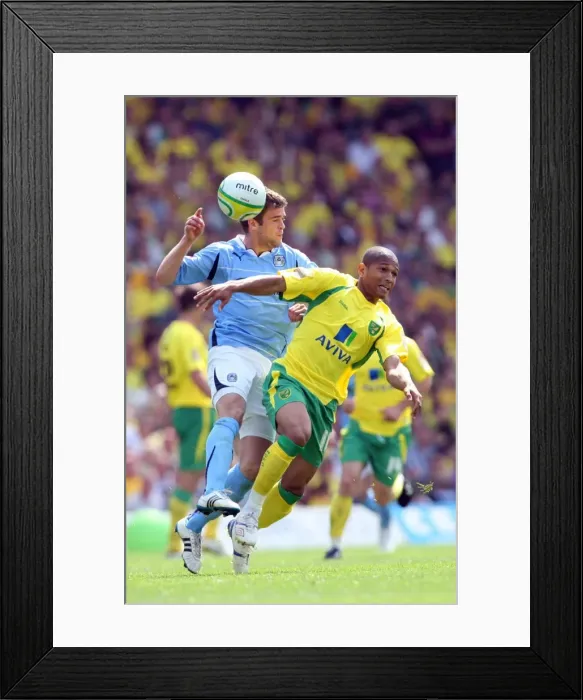Framed Print : Simeon Jackson vs. Martin Cranie: Intense Rivalry in the Npower Championship Clash between Norwich City and Coventry City (07-05-2011) Framed Print : Simeon Jackson vs. Martin Cranie: Intense Rivalry in the Npower Championship Clash between Norwich City and Coventry City (07-05-2011)