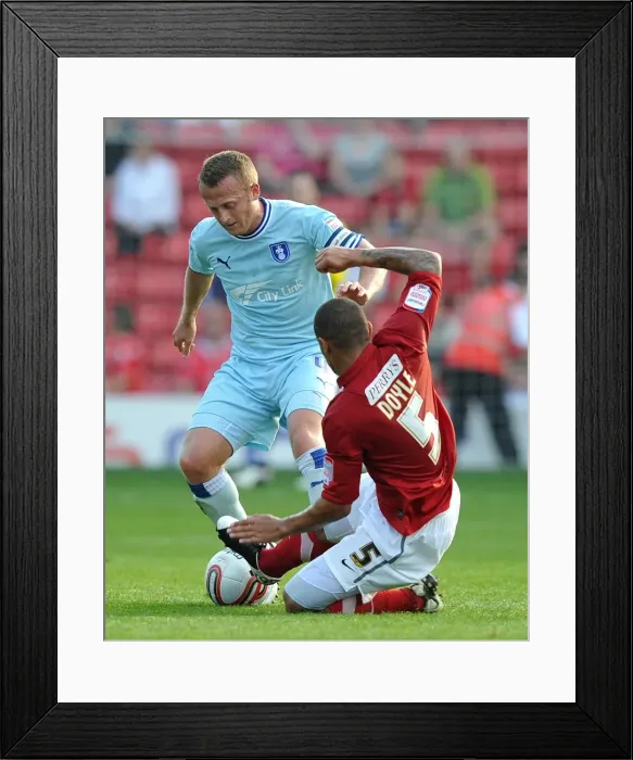 Framed Print : Clash at Oakwell: Sammy Clingan vs. Nathan Doyle, Coventry City vs. Barnsley, Football League Championship Framed Print : Clash at Oakwell: Sammy Clingan vs. Nathan Doyle, Coventry City vs. Barnsley, Football League Championship