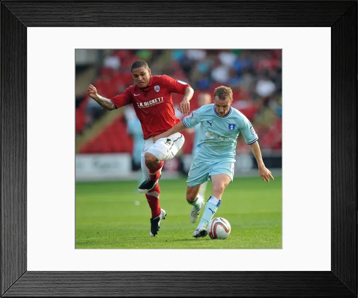 Framed Print : Gary McSheffrey vs. Nathan Doyle: Intense Battle for Ball Possession in Coventry City's Npower Championship Clash at Barnsley's Oakwell Stadium Framed Print : Gary McSheffrey vs. Nathan Doyle: Intense Battle for Ball Possession in Coventry City's Npower Championship Clash at Barnsley's Oakwell Stadium