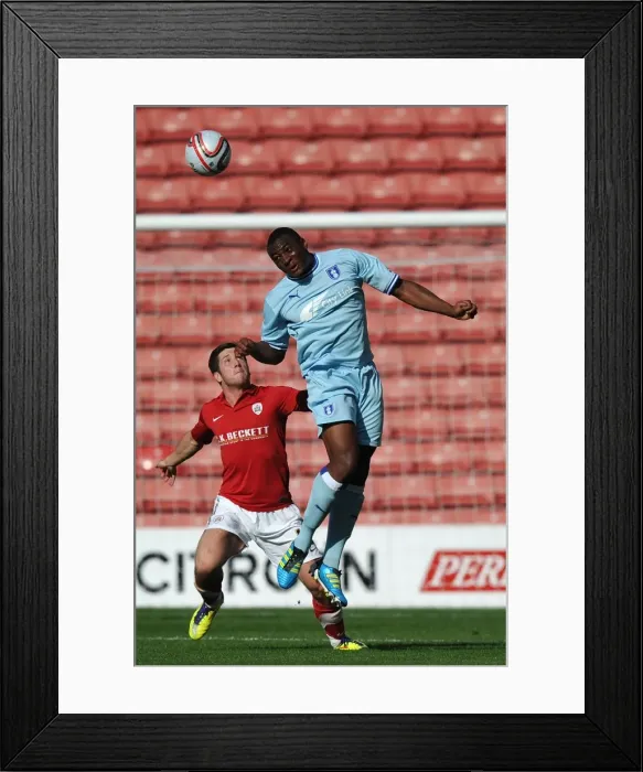 Framed Print : Intense Battle for Control: Npower Championship Showdown - Coventry City vs Barnsley