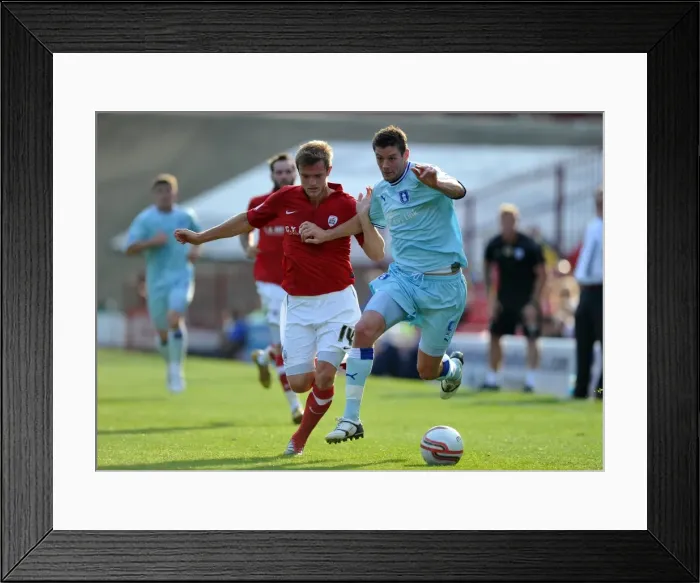 Framed Print : Intense Battle for Control: Wiseman vs. Jutkiewicz at Oakwell Stadium - Npower Championship Showdown (01-10-2011) Framed Print : Intense Battle for Control: Wiseman vs. Jutkiewicz at Oakwell Stadium - Npower Championship Showdown (01-10-2011)