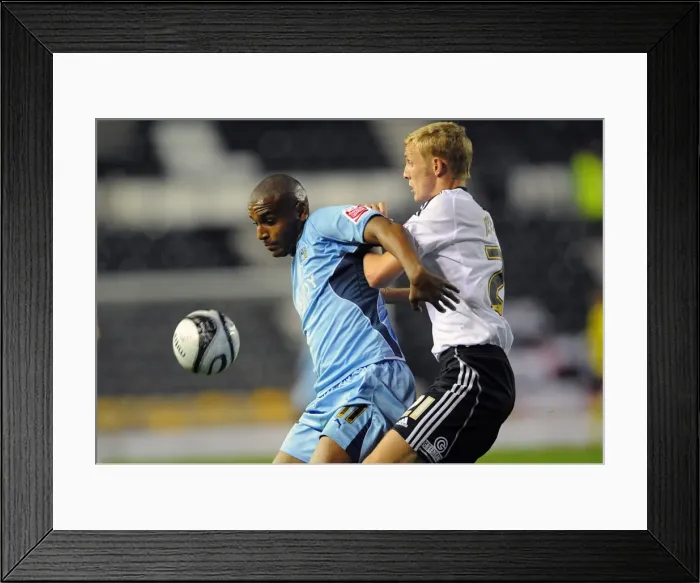 Framed Print : Clinton Morrison vs. Dean Moxey: A Battle in the Championship - Coventry City vs. Derby County at Pride Park Framed Print : Clinton Morrison vs. Dean Moxey: A Battle in the Championship - Coventry City vs. Derby County at Pride Park