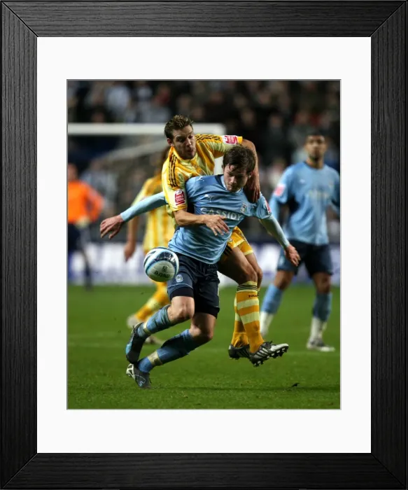 Framed Print : Intense Battle for Possession: Coventry City vs Newcastle United (Championship Clash at Ricoh Arena, 09-12-2009)