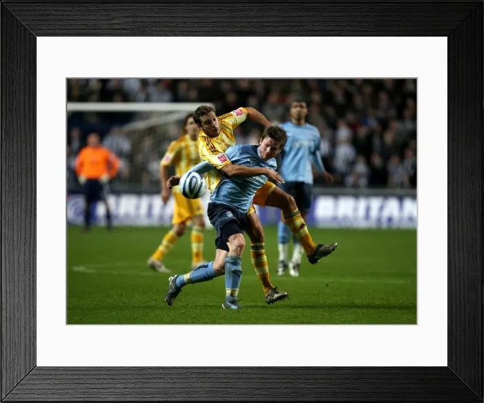 Framed Print : A Battle for Possession: Coventry City vs Newcastle United (Championship Clash at Ricoh Arena, 09-12-2009)