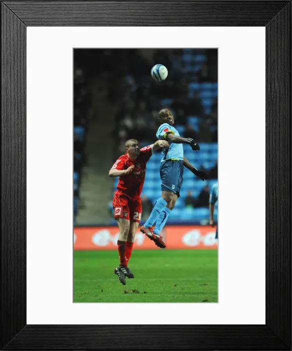 Framed Print : Clinton Morrison vs. Carl Dickinson: Intense Battle in Coventry City vs. Barnsley Championship Clash (09-01-2010) Framed Print : Clinton Morrison vs. Carl Dickinson: Intense Battle in Coventry City vs. Barnsley Championship Clash (09-01-2010)