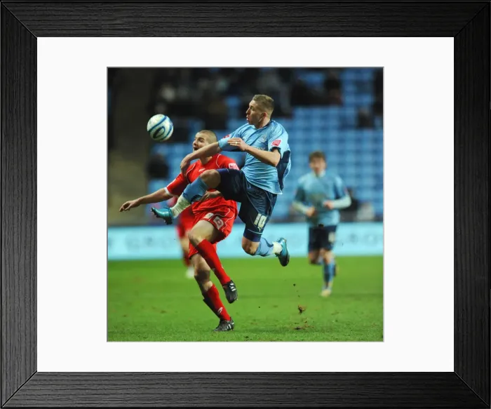 Framed Print : Coventry City vs Barnsley: Intense Battle for Control in Championship Match at Ricoh Arena