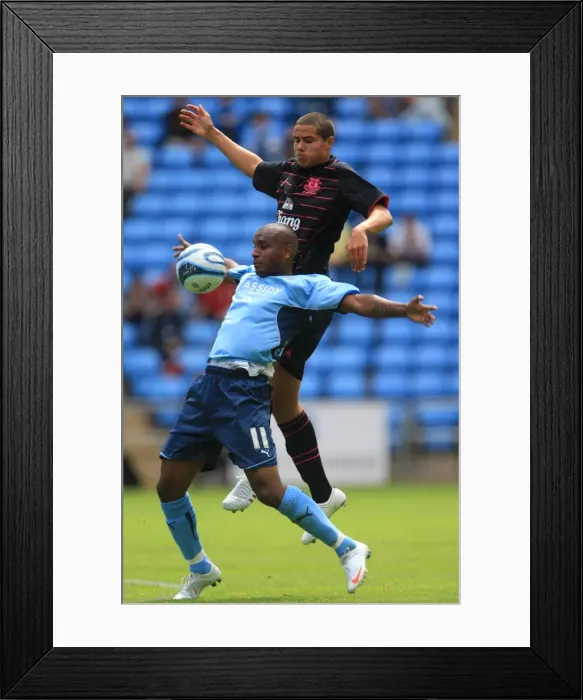 Framed Print : Clinton Morrison vs. Jack Rodwell: Intense Battle for the Ball in Coventry City's Pre-Season Friendly against Everton (August 2, 2009, Ricoh Arena) Framed Print : Clinton Morrison vs. Jack Rodwell: Intense Battle for the Ball in Coventry City's Pre-Season Friendly against Everton (August 2, 2009, Ricoh Arena)