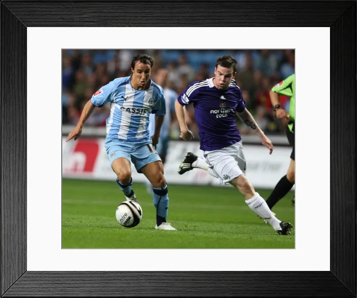 Framed Print : Micheal Misfud vs Danny Guthrie: Tussle in the Carling Cup Second Round between Coventry City and Newcastle United (26-08-2008) Framed Print : Micheal Misfud vs Danny Guthrie: Tussle in the Carling Cup Second Round between Coventry City and Newcastle United (26-08-2008)