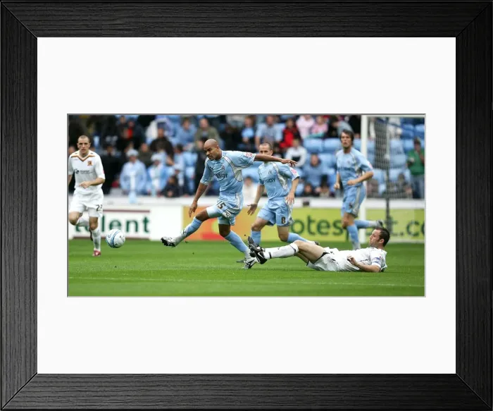 Framed Print : Coventry City vs Hull City: Leon Mackenzie Evades Ian Ashbee in Championship Clash at Ricoh Arena