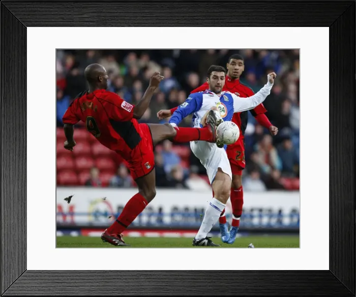 Framed Print : FA Cup Third Round: Dele Adebola and Zurab Khizanishvili Clash at Ewood Park Framed Print : FA Cup Third Round: Dele Adebola and Zurab Khizanishvili Clash at Ewood Park