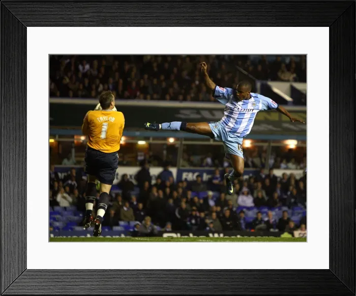 Framed Print : Clinton Morrison vs Maik Taylor: Intense Moment in Coventry City's Championship Clash at St. Andrews Stadium (03-11-2008) Framed Print : Clinton Morrison vs Maik Taylor: Intense Moment in Coventry City's Championship Clash at St. Andrews Stadium (03-11-2008)