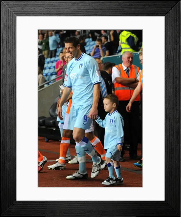 Framed Print : Lukas Jutkiewicz and Coventry City Mascot Leading the Team Out at Ricoh Arena vs Blackpool (Npower Championship, 2011)