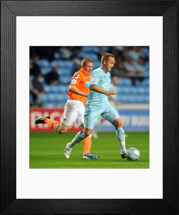 Framed Print : Clingan vs. Southern: Battle for Supremacy in Coventry City vs. Blackpool Championship Clash (September 2011)