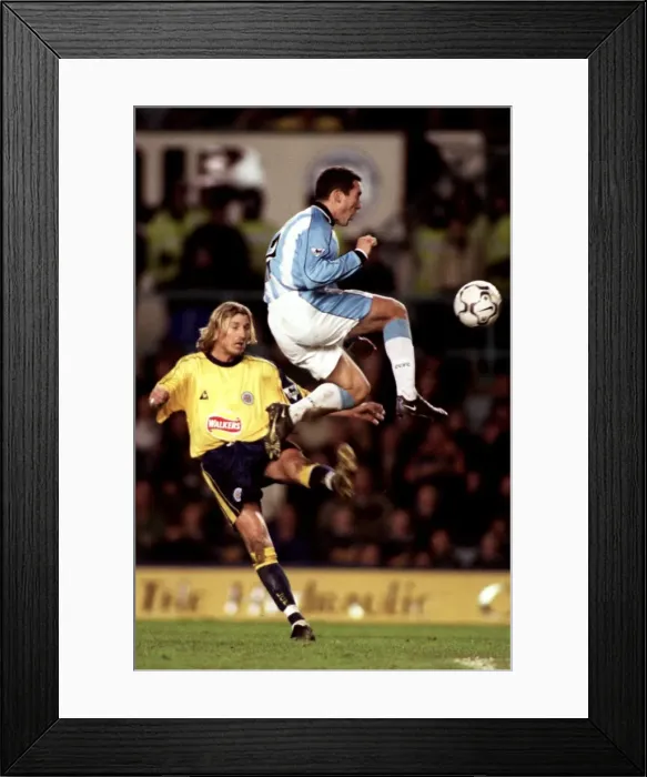 Framed Print : Clash at the Coventry Stadium: Coventry City vs. Leicester City - Savage Tackle on Telfer (Premier League, 10-12-2000) Framed Print : Clash at the Coventry Stadium: Coventry City vs. Leicester City - Savage Tackle on Telfer (Premier League, 10-12-2000)