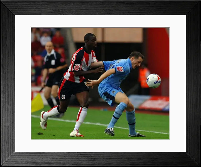 Framed Print : Bradley Wright-Phillips vs. David McNamee: Intense Battle in the Coca-Cola Championship at St. Mary's Stadium (Southampton v Coventry, 2006) Framed Print : Bradley Wright-Phillips vs. David McNamee: Intense Battle in the Coca-Cola Championship at St. Mary's Stadium (Southampton v Coventry, 2006)