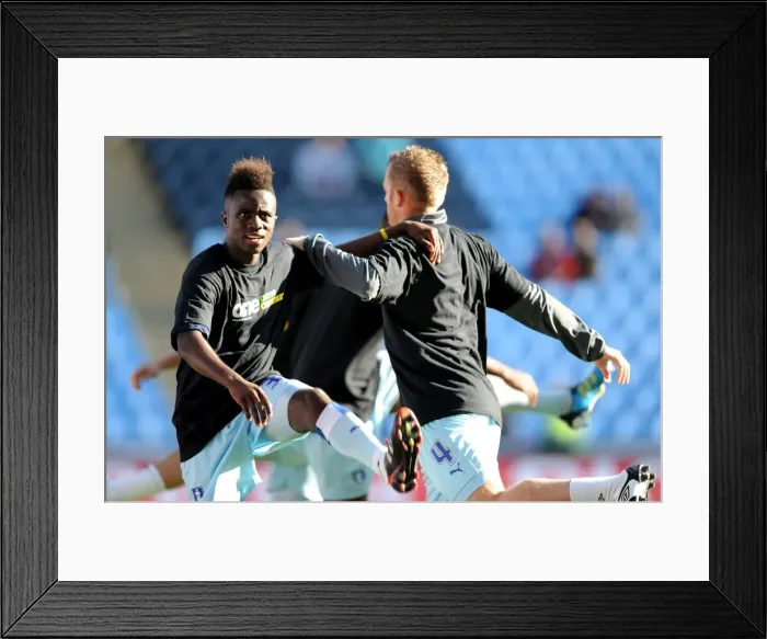 Framed Print : Coventry City FC: One Community - Gael Bigirimana and Sammy Clingan Warm Up in Unity T-shirts (vs Burnley, Championship 2011)