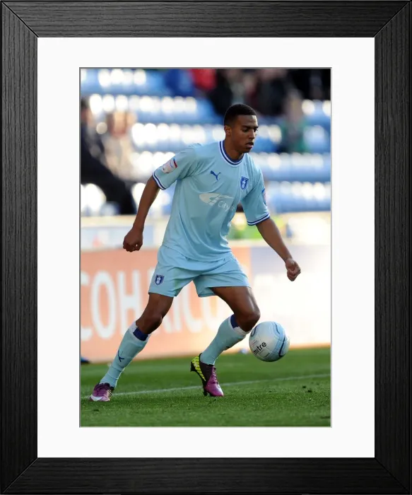 Framed Print : Cyrus Christie in Action: Coventry City vs Burnley (Npower Championship, 22-10-2011) Framed Print : Cyrus Christie in Action: Coventry City vs Burnley (Npower Championship, 22-10-2011)