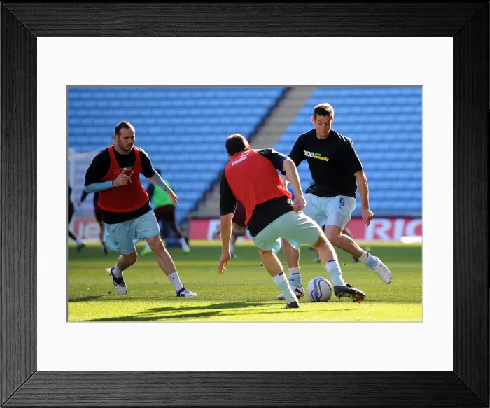 Framed Print : Lucas Jutkiewicz Gearing Up: Coventry City's Star Forward in Focus during Warm-Up vs Burnley (October 2011)