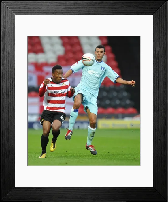 Framed Print : Battle for the Ball: Thomas vs. Dumbuya in Coventry City's Championship Clash Framed Print : Battle for the Ball: Thomas vs. Dumbuya in Coventry City's Championship Clash