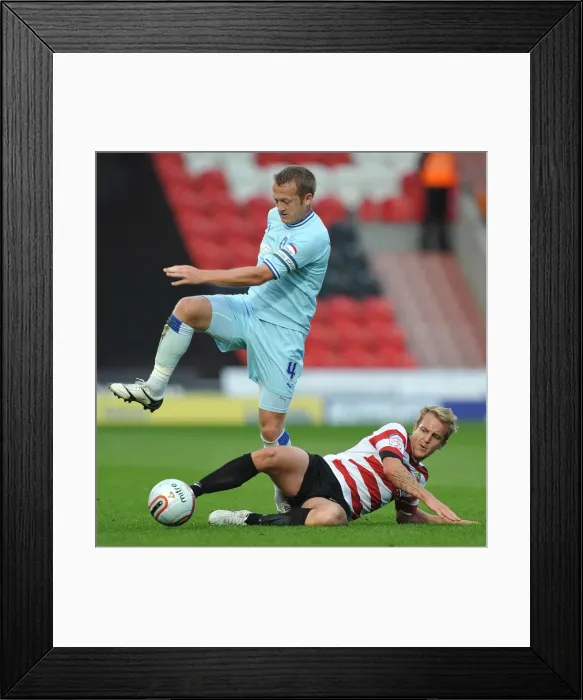 Framed Print : Clingan vs. Coppinger: Intense Tackle in Coventry City vs. Doncaster Rovers Championship Clash Framed Print : Clingan vs. Coppinger: Intense Tackle in Coventry City vs. Doncaster Rovers Championship Clash