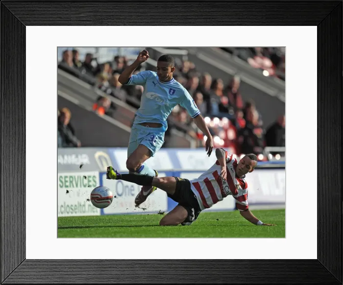 Framed Print : Intense Rivalry: Cyrus Christie vs Kyle Bennett Battle for Ball Supremacy in Coventry City vs Doncaster Rovers Championship Clash