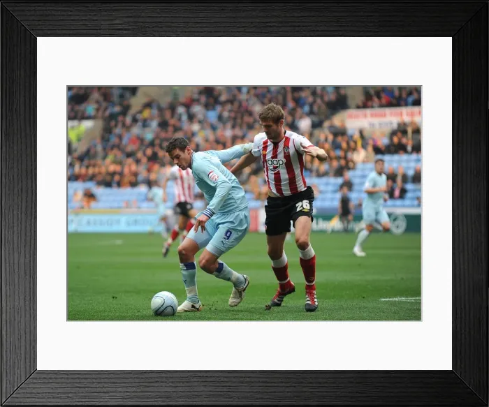 Framed Print : Battle for the Ball: Jutkiewicz vs. Hooiveld - Coventry City vs. Southampton (Npower Championship) Framed Print : Battle for the Ball: Jutkiewicz vs. Hooiveld - Coventry City vs. Southampton (Npower Championship)