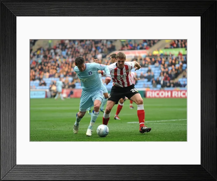 Framed Print : Battle for the Ball: Coventry City vs. Southampton - Coventry's Lukas Jutkiewicz vs. Southampton's Jos Hooiveld in Npower Championship Clash at Ricoh Arena Framed Print : Battle for the Ball: Coventry City vs. Southampton - Coventry's Lukas Jutkiewicz vs. Southampton's Jos Hooiveld in Npower Championship Clash at Ricoh Arena