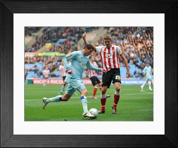 Framed Print : Coventry Citys Lukas Jutkiewicz (left) and Southamptons Jos Hooiveld (right) battle for the ball Framed Print : Coventry Citys Lukas Jutkiewicz (left) and Southamptons Jos Hooiveld (right) battle for the ball