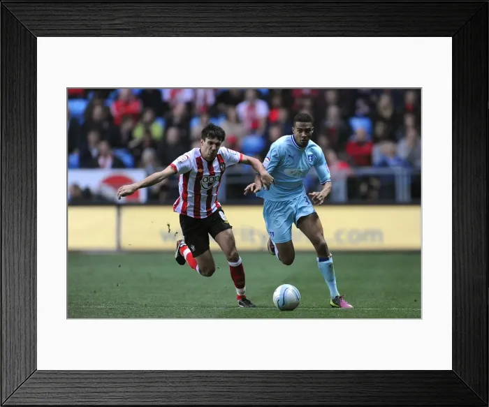 Framed Print : Battleground Ricoh Arena: Cyrus Christie vs Jack Cork - A Football Rivalry Unfolds