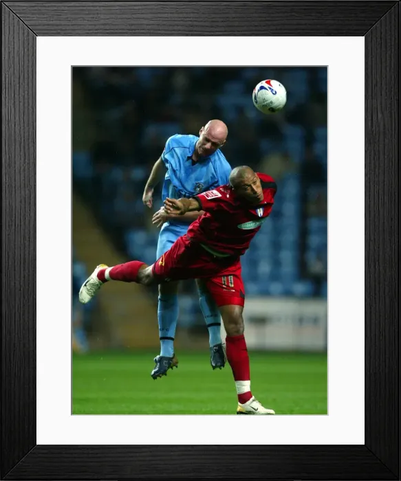 Framed Print : Page vs. Iwelumo: Clash of the Titans at Coventry City vs. Colchester United (23-10-2006) Framed Print : Page vs. Iwelumo: Clash of the Titans at Coventry City vs. Colchester United (23-10-2006)