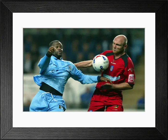 Framed Print : Stern John vs. Wayne Brown: A Riveting Rivalry at Coventry City's Ricoh Arena (October 23, 2006) Framed Print : Stern John vs. Wayne Brown: A Riveting Rivalry at Coventry City's Ricoh Arena (October 23, 2006)