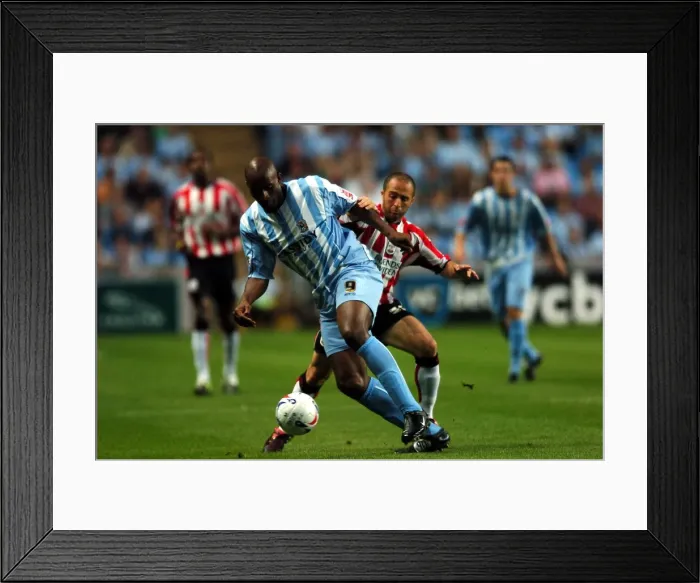 Framed Print : Clash of Stars: Dele Adebola vs. Djamel Belmadi (Coventry City vs. Southampton, 29-08-2005) Framed Print : Clash of Stars: Dele Adebola vs. Djamel Belmadi (Coventry City vs. Southampton, 29-08-2005)