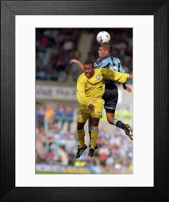 Framed Print : Leap of Faith: Wallace vs. Hall - Intense Battle for the Ball in Coventry City vs. Leeds United (1990s)
