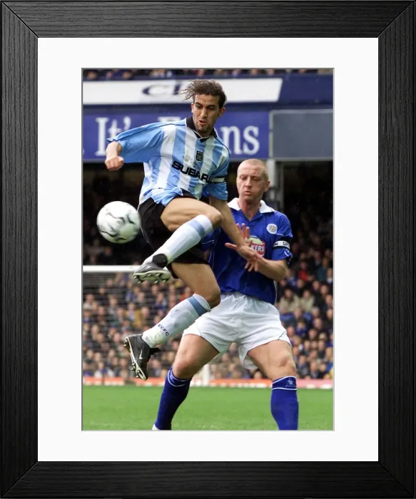 Framed Print : Mid-Air Battle: Hadji vs Elliott in the FA Carling Premiership Clash at Filbert Street Framed Print : Mid-Air Battle: Hadji vs Elliott in the FA Carling Premiership Clash at Filbert Street