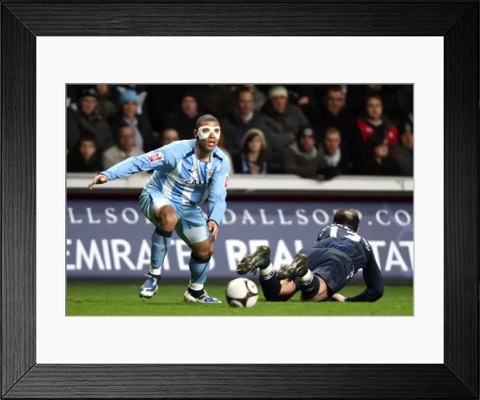 Framed Print : Coventry City's Leon Best Evades Zurab Khizanshvili in FA Cup Fifth Round Replay Framed Print : Coventry City's Leon Best Evades Zurab Khizanshvili in FA Cup Fifth Round Replay