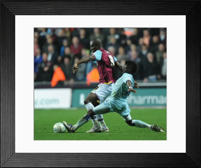 Framed Print : Gael Bigirimana vs. Carlton Cole: Intense Tackle in Coventry City vs. West Ham United Npower Championship Clash (19-11-2011) Framed Print : Gael Bigirimana vs. Carlton Cole: Intense Tackle in Coventry City vs. West Ham United Npower Championship Clash (19-11-2011)