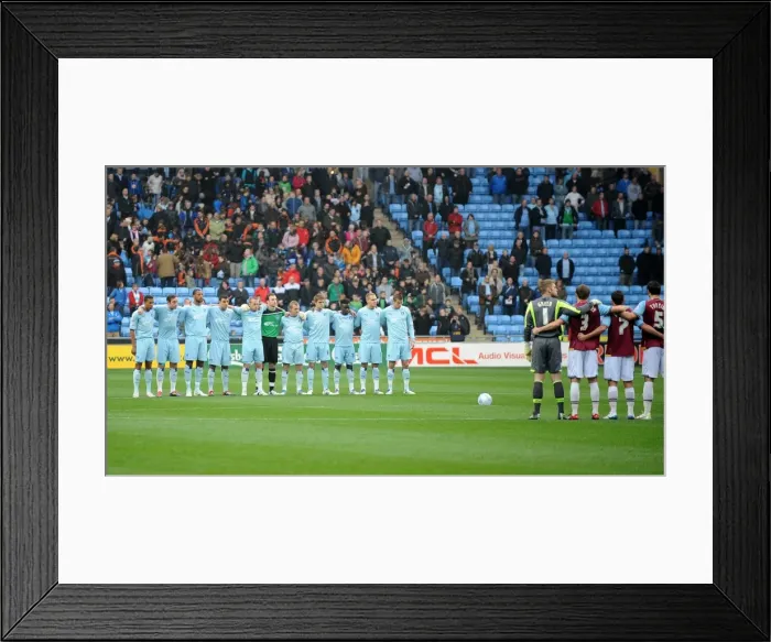 Framed Print : A Moment of Silence: Honoring Coventry's Resilient Past - Coventry City vs. West Ham United (November 19, 2011)