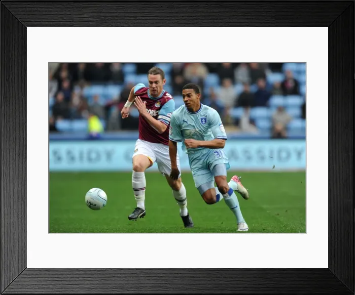 Framed Print : Intense Rivalry: Cyrus Christie vs. Kevin Nolan Battle for Ball (Npower Championship, Coventry City vs. West Ham United, 19-11-2011) Framed Print : Intense Rivalry: Cyrus Christie vs. Kevin Nolan Battle for Ball (Npower Championship, Coventry City vs. West Ham United, 19-11-2011)